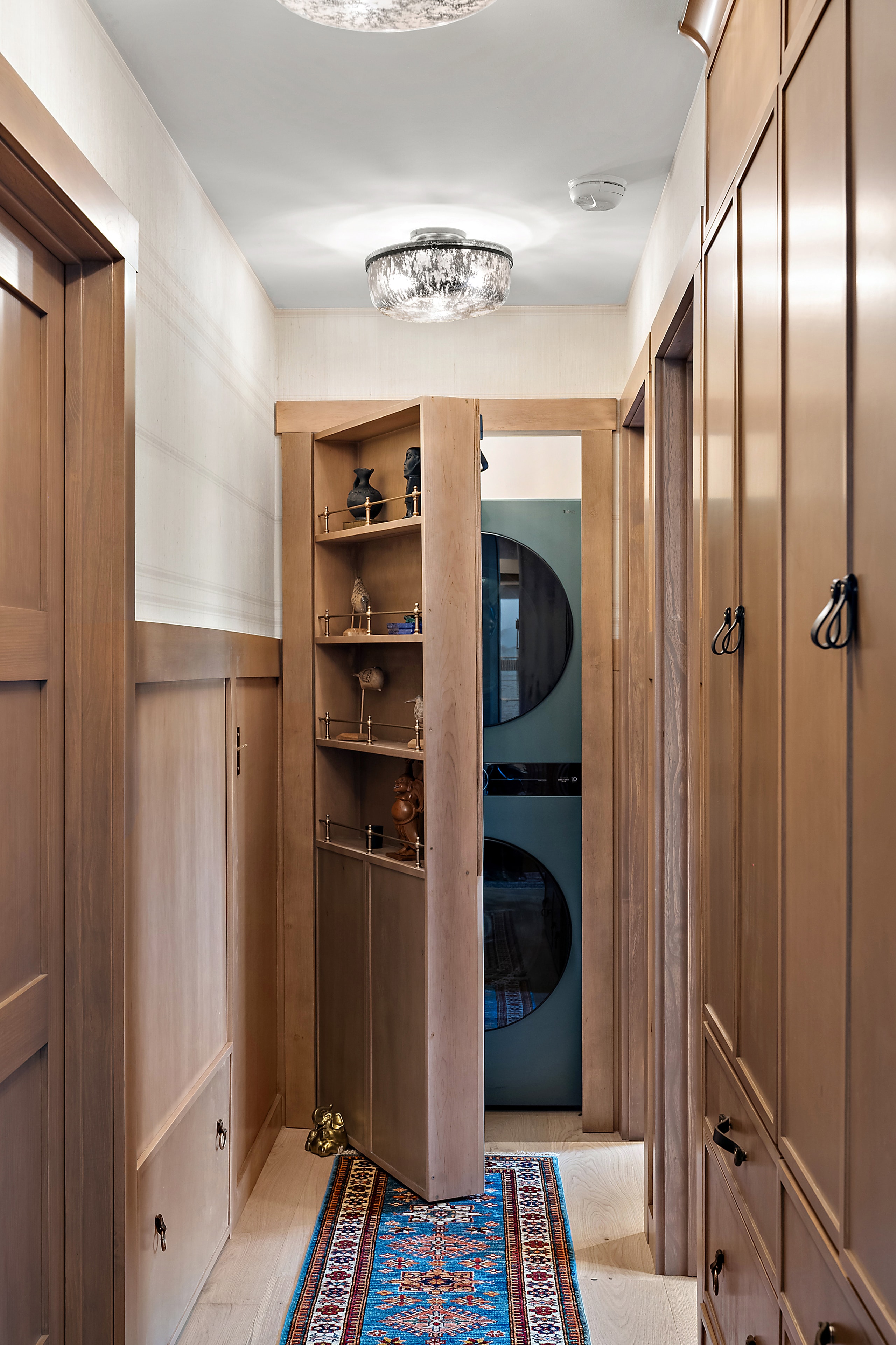 Modern hallway with wooden cabinetry and shelving