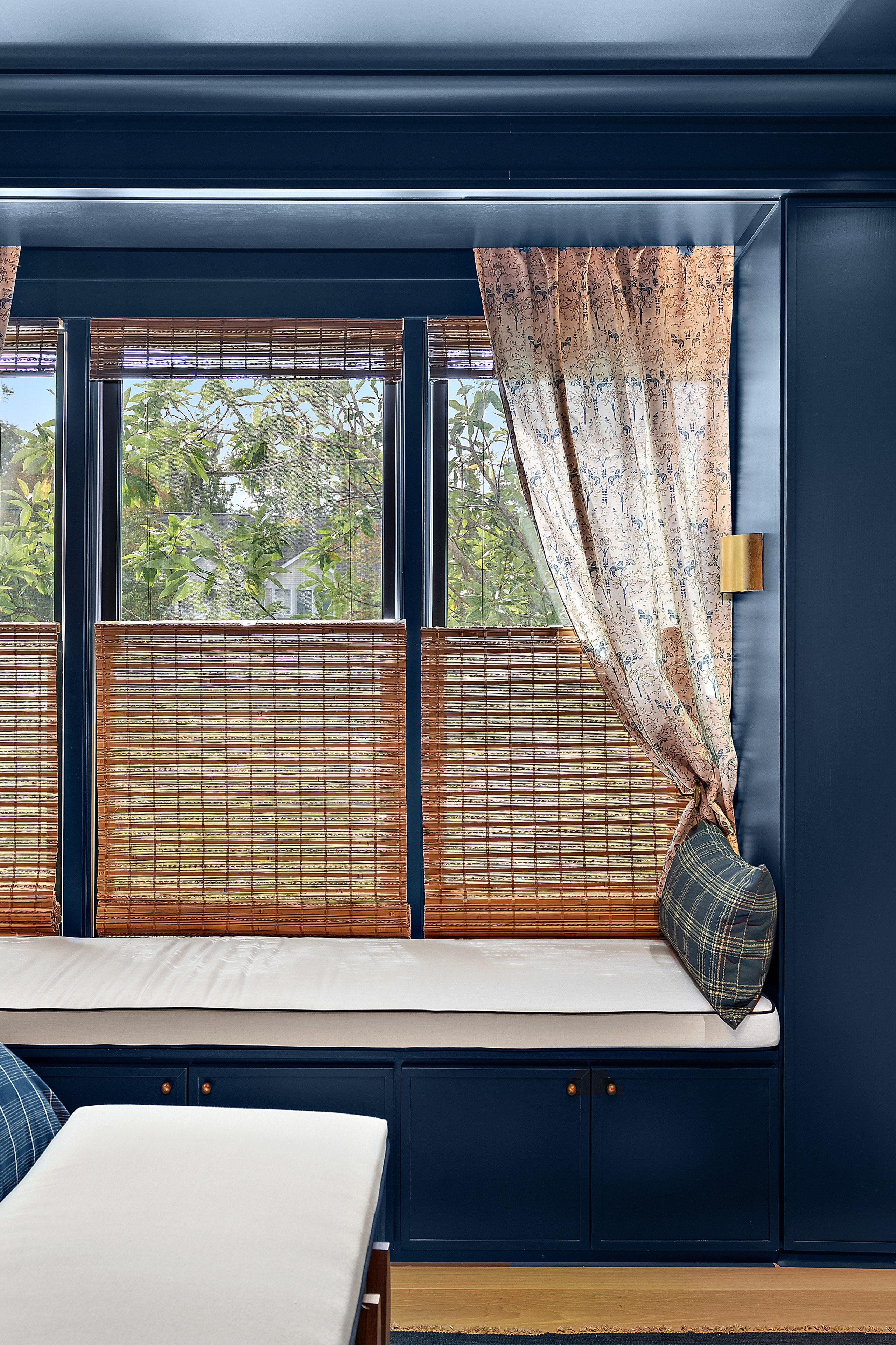 Modern bedroom window with woven shades